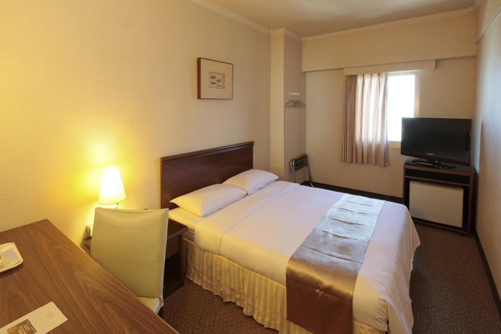 Lincoln Hotel Тайнан Стая снимка